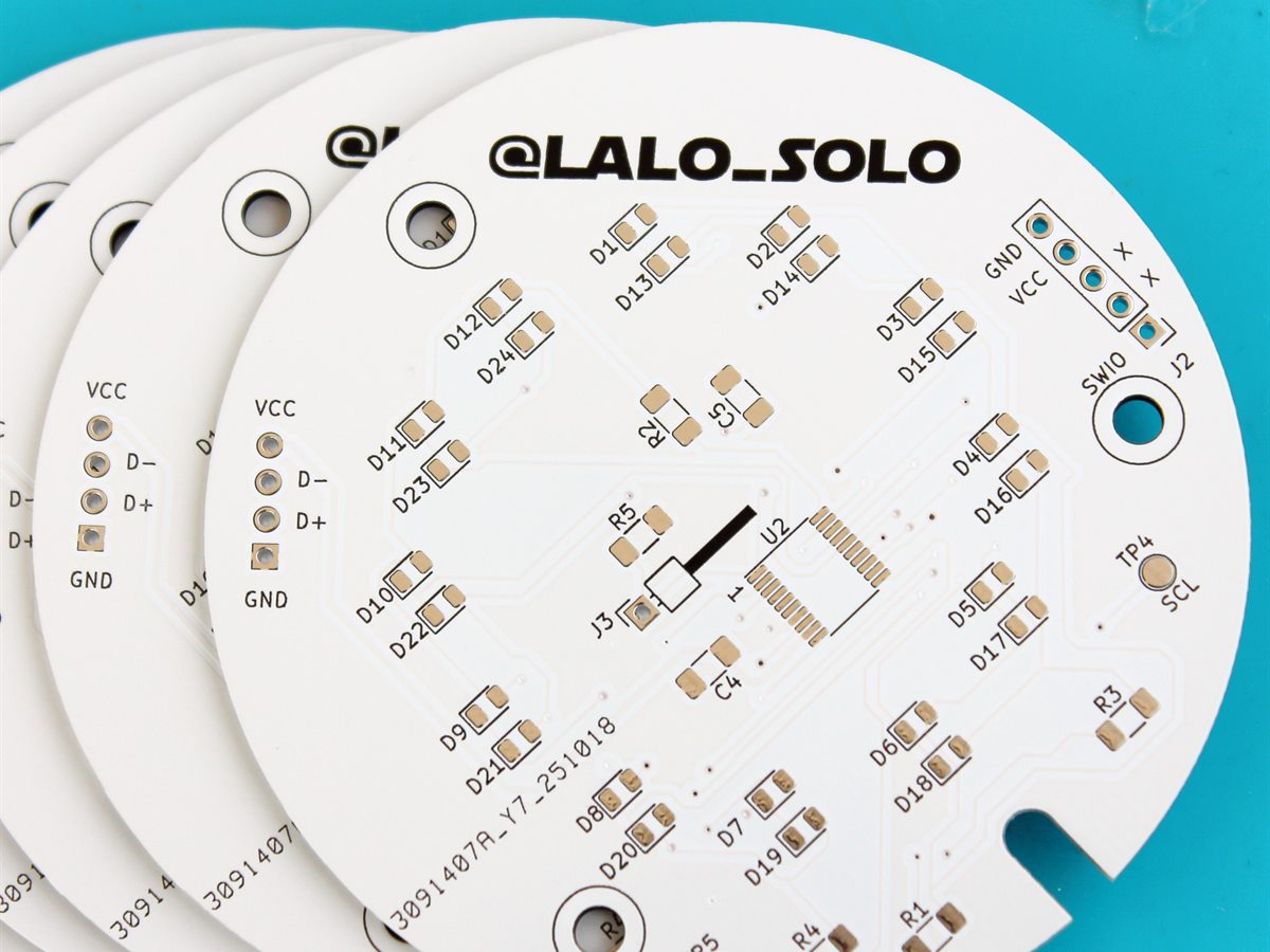A stack of bare round Auto-Click PCBs branded @LALO_SOLO